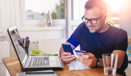 Man on laptop using online banking service