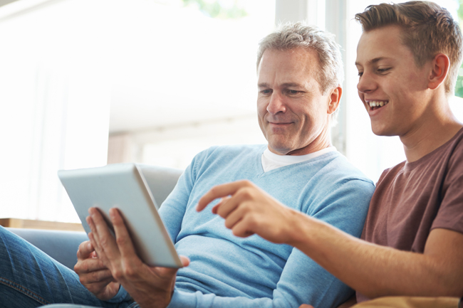 Father and son logging into MyPlans to do business with Foresters