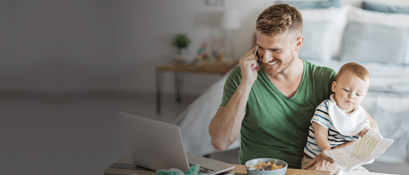 Happy father talking to our Customer Services team from the comfort of his home