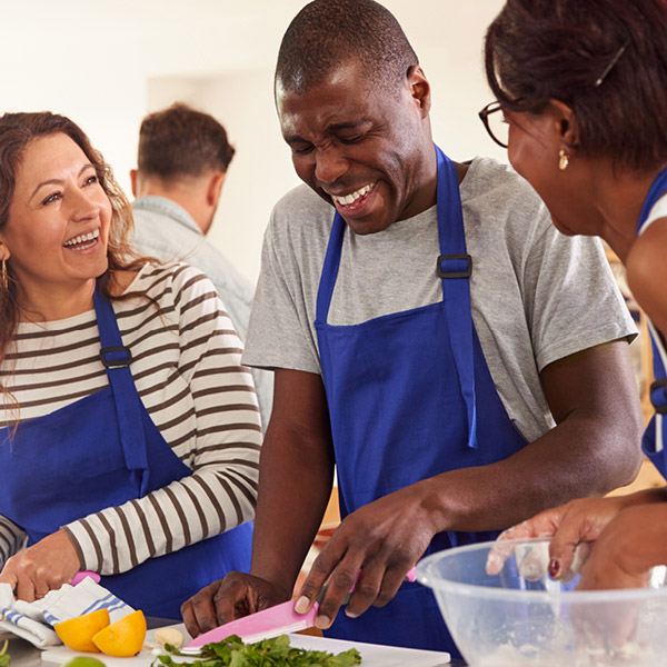 Volunteers cooking together
