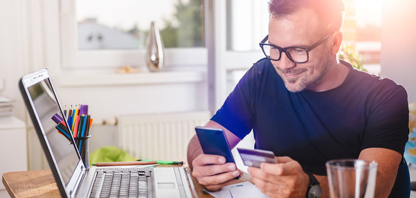 Man on laptop using online banking service